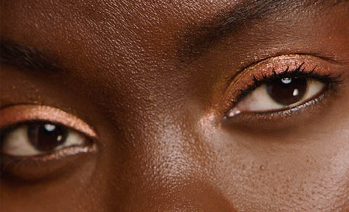 Macro shot of model wearing Shadowstix Diamonds Diamond Veil Eyeshadow Stick.