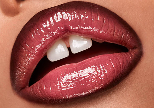 Model lip closeup wearing Gloss Bomb Stix Gloss Stick.