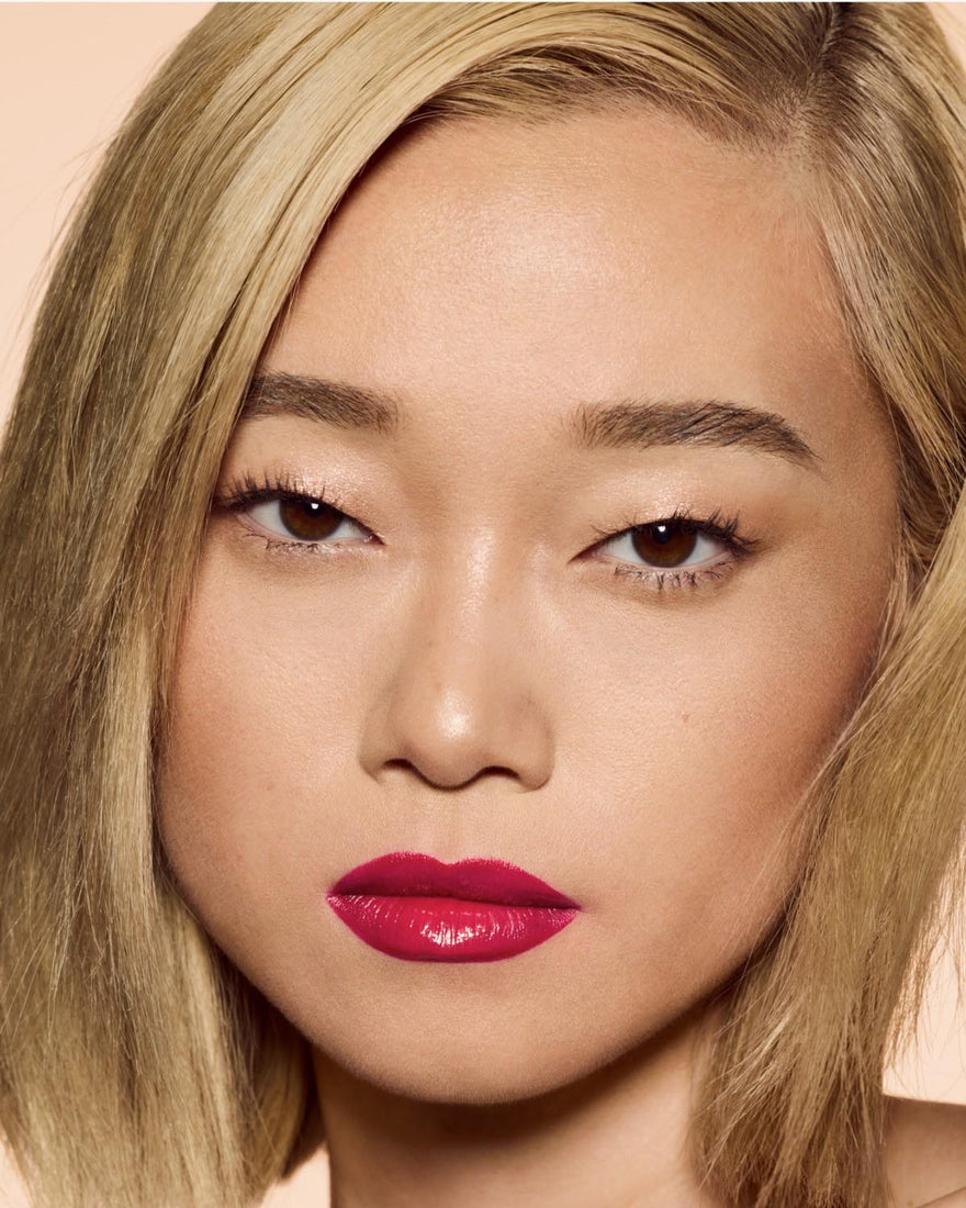 light skin tone model wearing poutsicle hydrating lip stain in shade mai type