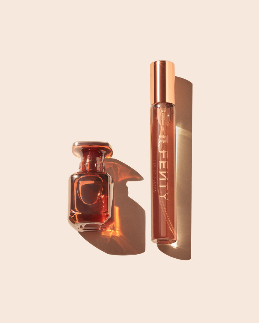 Two Fenty eau de parfum bottles on a beige background