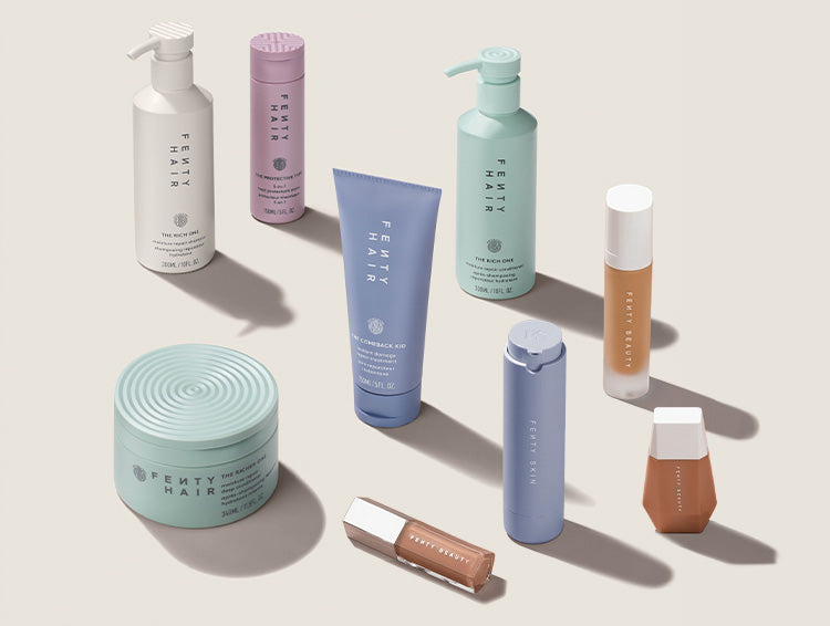 Makeup, skincare, and hair products on a plain background.