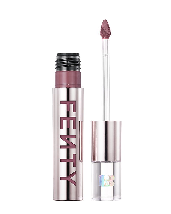 An open Fenty Icon Velvet lipstick tube on a light background.