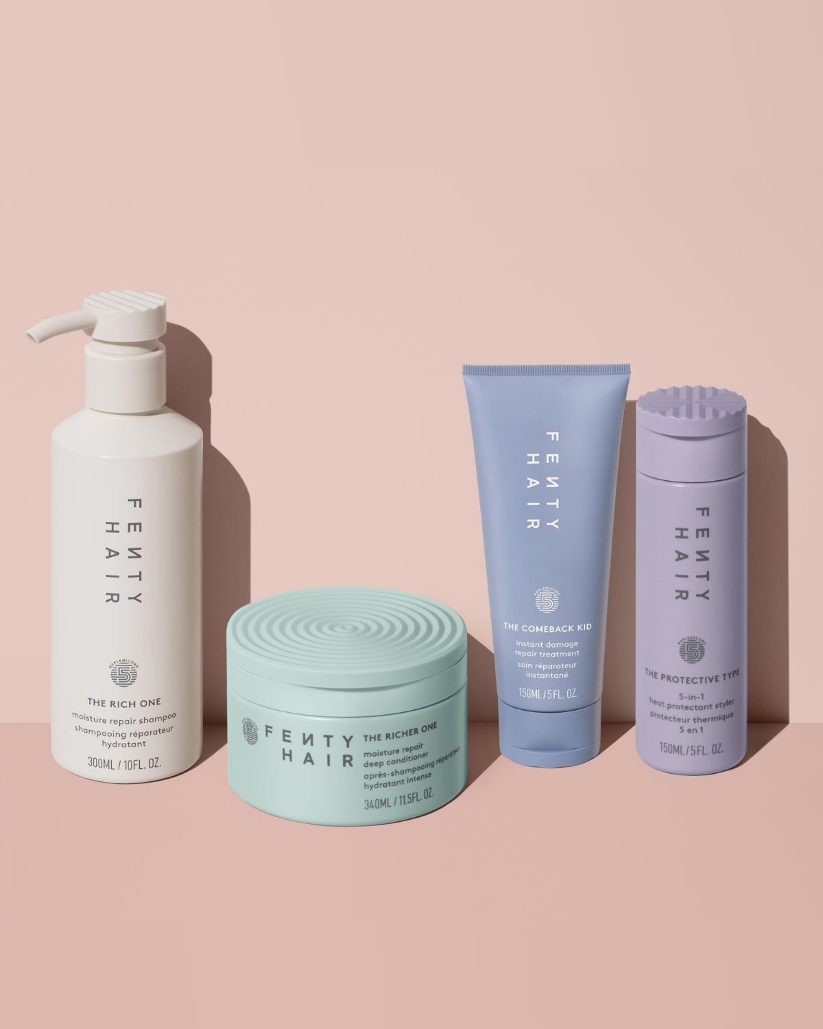 Fenty Hair shampoo next to deep conditioner, hair damage repair treatment, and 5-in-1 heat protectant hair styler.