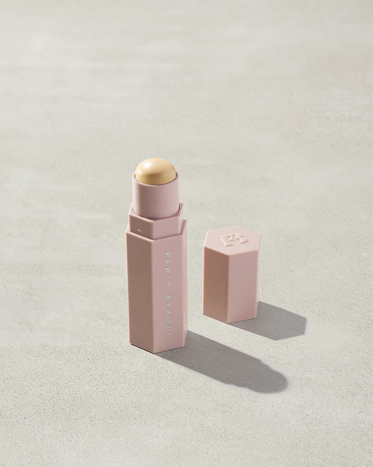 Match Stix Corrector Skinstick shown in shade Banana with open packaging on a concrete background.