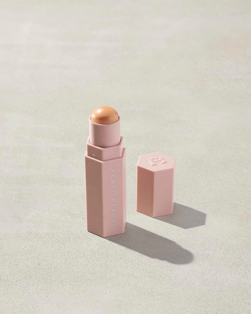 Match Stix Corrector Skinstick shown in shade Peach with open packaging on a concrete background.
